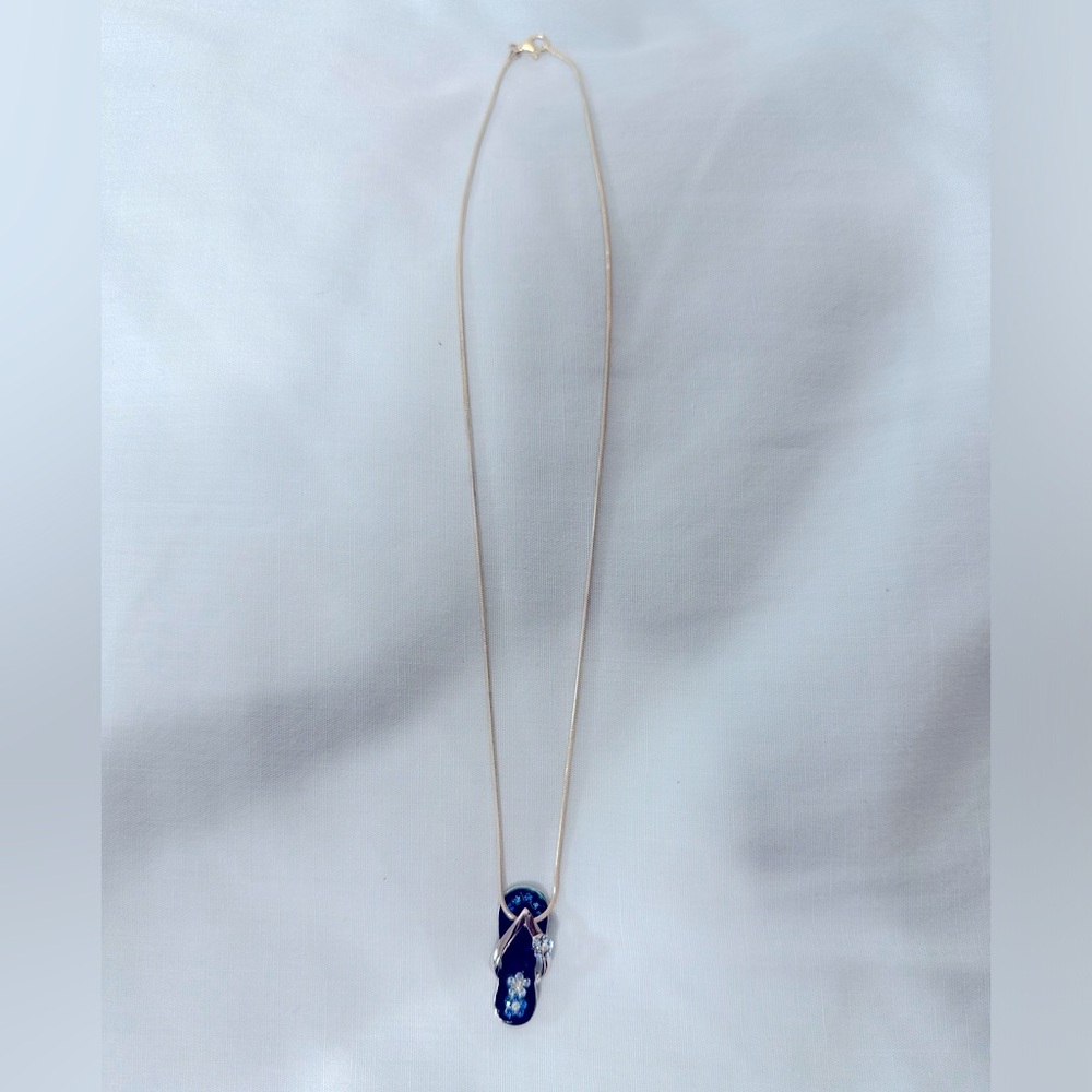 Silver necklace with blue flip flop pendant